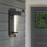 Horizone 5.5" Minimalist Industrial Iron/Glass Seeded Glass with Dusk-to-Dawn Sensor Integrated LED Outdoor Sconce - JONATHAN Y