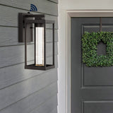 Juno 4.75" Industrial Vintage Iron/Glass Seeded Glass with Dusk-to-Dawn Sensor Integrated LED Outdoor Sconce - JONATHAN Y