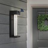 Miranda 5.13" Modern Industrial Iron/Glass Seeded Glass with Dusk-to-Dawn Sensor Integrated LED Outdoor Sconce - JONATHAN Y