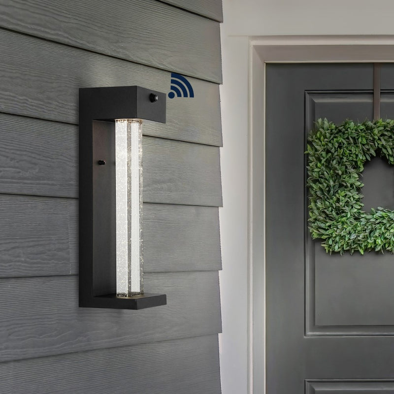 Miranda 5.13" Modern Industrial Iron/Glass Seeded Glass with Dusk-to-Dawn Sensor Integrated LED Outdoor Sconce - JONATHAN Y