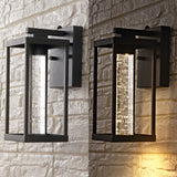 Juno 4.75" Industrial Vintage Iron/Glass Seeded Glass with Dusk-to-Dawn Sensor Integrated LED Outdoor Sconce - JONATHAN Y