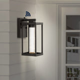 Juno 4.75" Industrial Vintage Iron/Glass Seeded Glass with Dusk-to-Dawn Sensor Integrated LED Outdoor Sconce - JONATHAN Y
