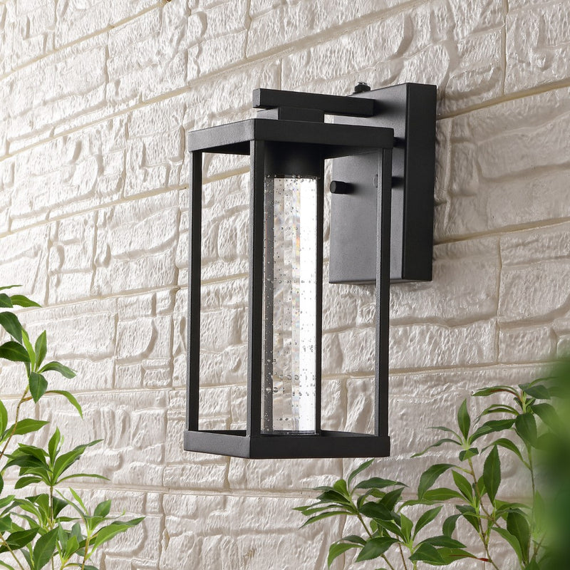 Juno 4.75" Industrial Vintage Iron/Glass Seeded Glass with Dusk-to-Dawn Sensor Integrated LED Outdoor Sconce - JONATHAN Y
