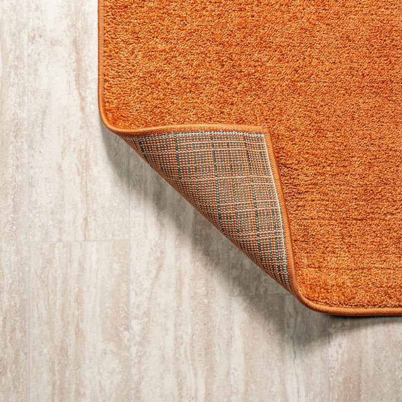 Haze Solid Low-pile Area Rug Orange