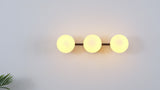 Nash 23 in. 3-Light Mid-Century Modern Metal and Frosted Glass Globe LED Vanity Light